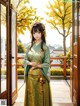 A woman in a green and gold kimono standing in front of a door.